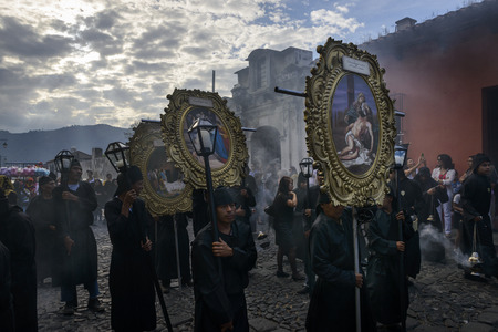 Antigua, Guatemala - April 19, 2014: People in a street of the old city of Antigua during a...