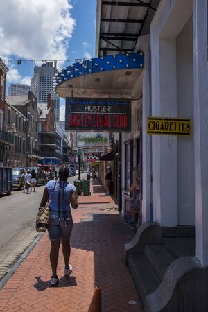 New Orleans, Louisiana - June 18, 2014: Street scene at the Bourbon Street, in the French Quarter in the city of New Orleans, Louisiana, USAのeditorial素材