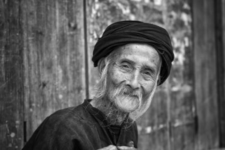 Dazhai, China - August 4 ,2012: Portrait of an old chinese man in the village of Dazhai in China, Asiaのeditorial素材