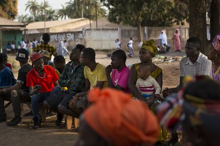 Bissau, Republic of Guinea-Bissau - January 29, 2018: A group of people at a community reunion in...