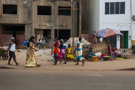 Bissau, Republic of Guinea-Bissau - January 28, 2018: Street scene in the city of Bissau with people...
