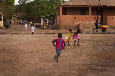 Bissau, Republic of Guinea-Bissau - January 31, 2018: Group of children playing at the Cupelon de Baixo neighborhood in the city of Bissau, Guinea Bissau.のeditorial素材