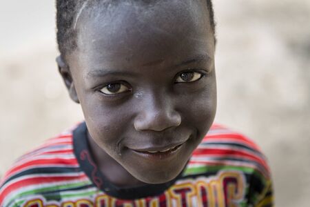 Orango Island, Guinea-Bissau - February 3, 2018:  Portrait of a beautiful boy at the village of Eticoga in the island of Orango.のeditorial素材
