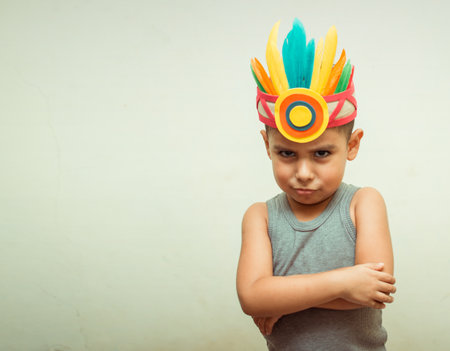 kid in native american costume isolated in white, with copy space.の写真素材