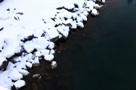 Snow and the Salzach river at Salzburg, Austriaの写真素材
