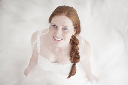 Portrait of Beautiful freckled redhead Brideの写真素材