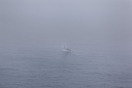 Sailing through fogの写真素材
