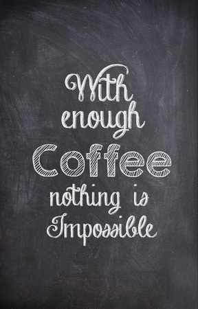 Coffee Quote written with chalk on a black boardの写真素材