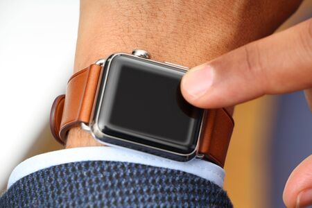 Interracial businessman using a smartwatch copyspaceの写真素材