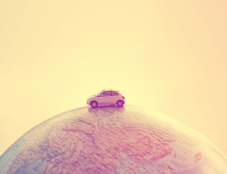 Miniature car traveling the world Vintage style