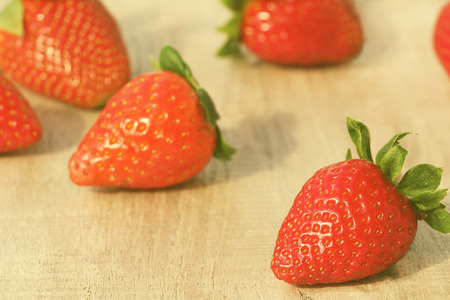 Fresh red strawberries on old wooden backgroundの写真素材