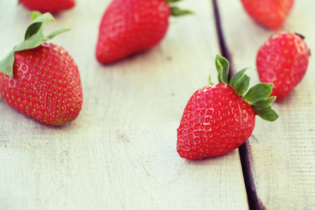 Fresh red strawberries on old wooden backgroundの写真素材