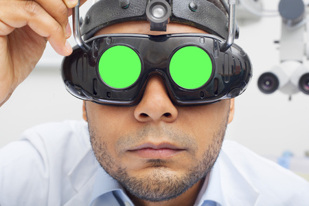 Otolaryngologist Looking Through Magnifying Loupe mockup