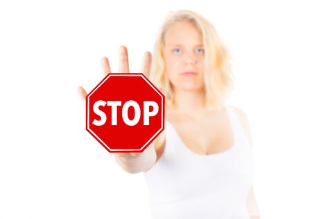 Woman signing STOP with her handの写真素材