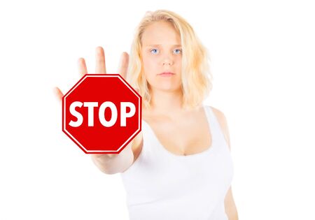 Woman signing STOP with her handの写真素材
