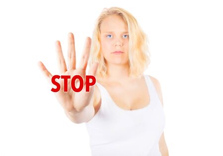 Woman signing STOP with her handの写真素材