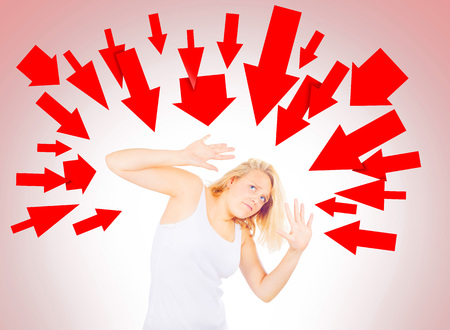 Woman pressured by multiple issuesの写真素材