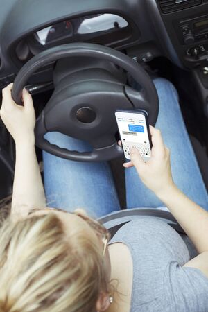 Woman texting while Driving
