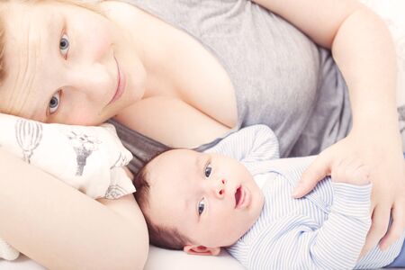 Mother and baby cuddling
