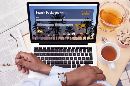 Man booking his next vacation tripの写真素材