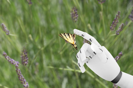 Robot hand with a butterfly on it's fingerの写真素材
