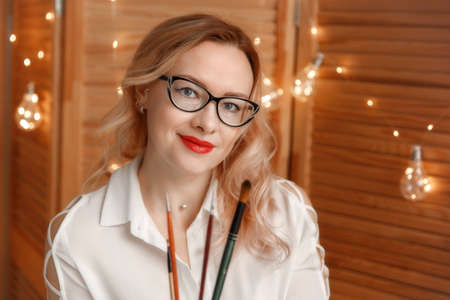 Close up portrait of beautiful young businesswoman wearing eyeglasses. Business woman in glasses...