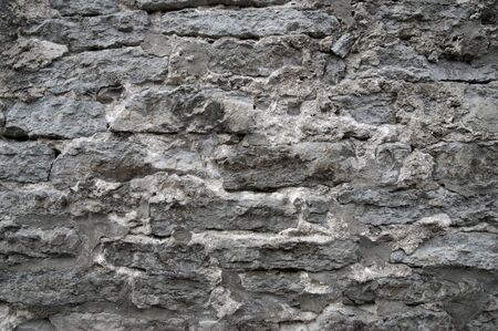 Texture of a grunge old stone wallの写真素材