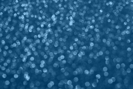 Blue glowing dynamic festive  shining sparkles bokeh.
