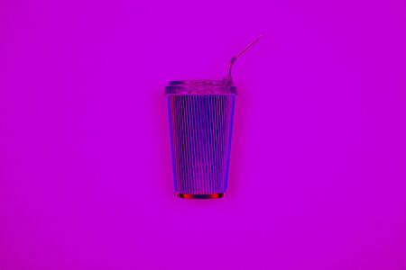 Neon pink reusable iron coffee cup on lilac background. Fragrant takeaway drink, layout for coffee. Business and service concept. Delicious morning hot drink. Bright hipster trendy design.の写真素材