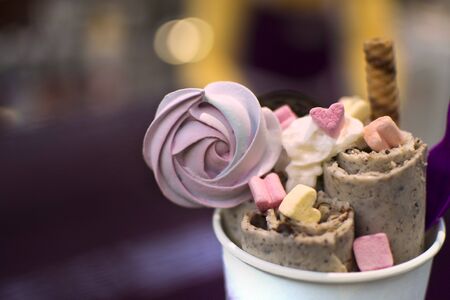 Handmade natural ice cream roll made from organic products. Healthy food concept. Ice cream from...