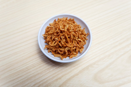 crispy fried noodles snack in bowlの写真素材