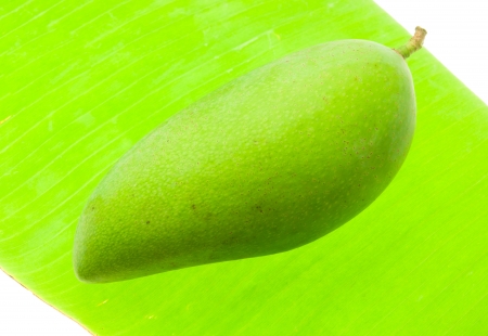 Green mango on banan leaf, fruite of Thailand の写真素材