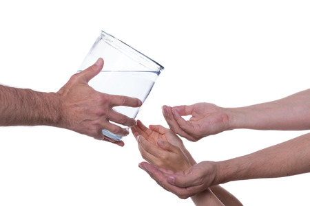 Hands are reaching out to clean drinking water which is served to them