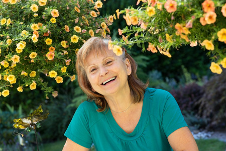 Sprightly senior looking happy and smiling at the camera