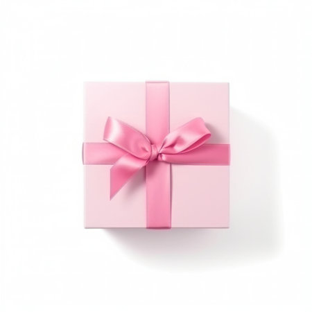 Pink gift box with pink bow isolated on white background, top viewの写真素材