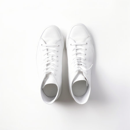 White sneakers isolated on white background. Flat lay, top view.の写真素材
