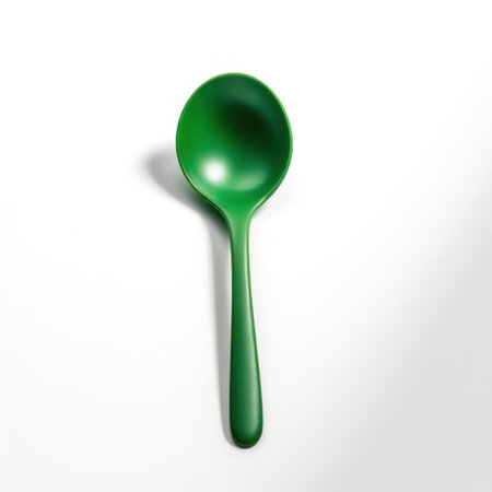 Green plastic spoon isolated on white background. 3D illustration. Copy-space.の写真素材