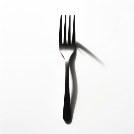 Fork with shadow on white background. Minimalism concept.の写真素材