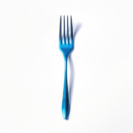 Blue plastic fork isolated on white background.の写真素材