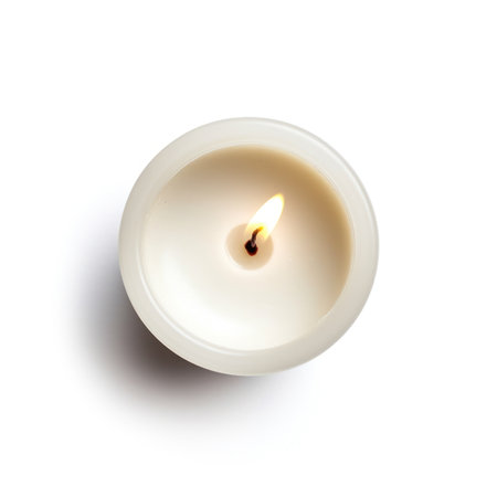 Burning candle on white background, top view. Space for textの写真素材