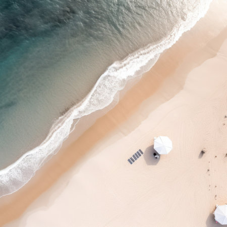 Aerial view of beautiful sandy beach with umbrellas and blue seaの写真素材