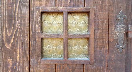 old door with yellow glassesの写真素材