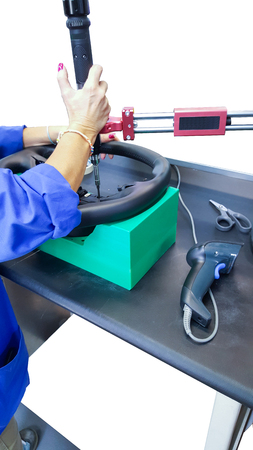 luxury assembly of the steering wheel radio controls in a factory 2の写真素材