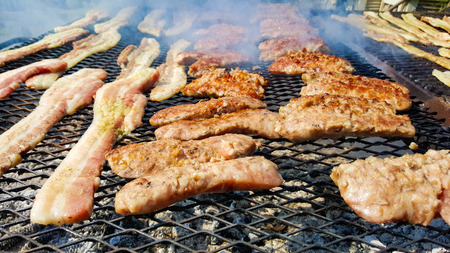 crispy bacon and sausage cooked on bbq 2の写真素材