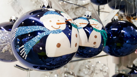 blue Christmas baubles decorated with snowmenの写真素材