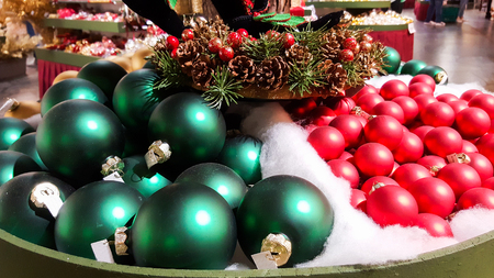 colored christmas balls exposed in a shopの写真素材