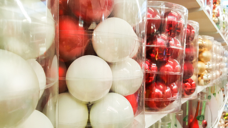 Christmas baubles displayed on the shelves of a shopの写真素材