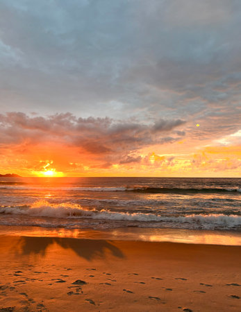 Sunset on the beach in the tropics. Seascape.