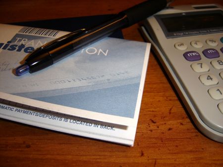 Pen,calculator,register and checksの写真素材