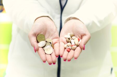 Pharmacist chemist woman show a pill. Pharmacy drugstore is background